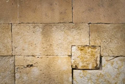 Large stone wall of an old building. Stock Photos