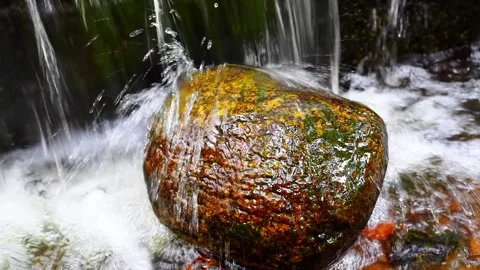 A large stone on which water flows Stock Footage 145454364