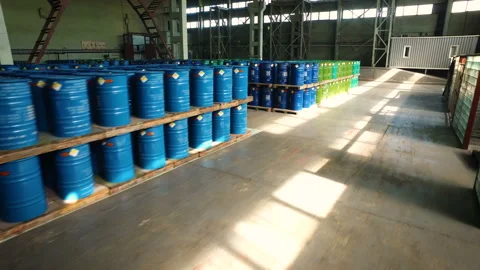 Large storage room. Multi-colored barrels of radioactive substances. Warehouse Stock Footage 98083110