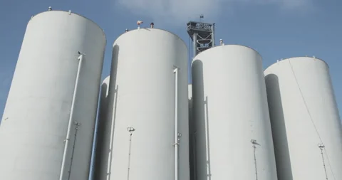 Large storage tanks hold rocket fuel at the SpaceX Starship test facility Stock Footage 202452976