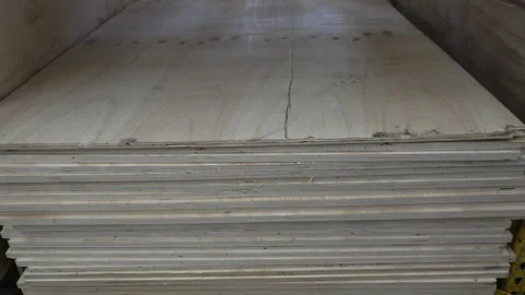 Large storage of various wood panels and timber sheets in a warehouse Vídeo Stock 331069919