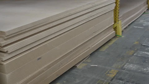 Large storage of various wood panels and timber sheets in a warehouse 스톡 동영상 331070482