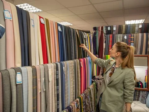 A large store of various fabrics and accessories for tailoring. Stock Photos