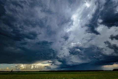 A large storm cloud with a raindrop Stock Photos