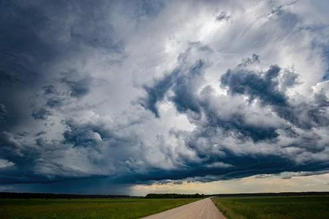 A large storm cloud with a raindrop Stock Photos