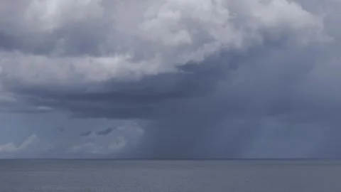 Large storm clouds building over a calm ocean at Mabua Beach, Surigao City Video stock 308458326