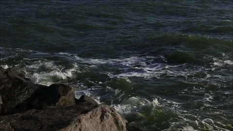 Large storm sea waves breaking on the rocks Stock Footage 73462363