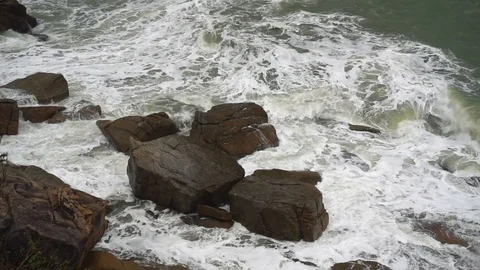 Large storm waves crashing on rocks in slow motion Stock Footage 111470336