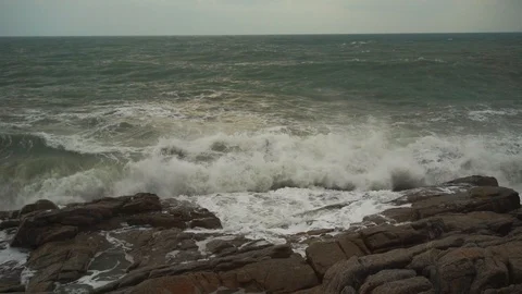 Large storm waves crashing on rocks in slow motion Stock Footage 111470505