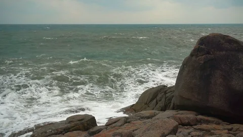 Large storm waves crashing on rocks in slow motion Stock Footage 111470528