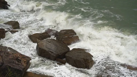 Large storm waves crashing on rocks in slow motion Stock Footage 111470563