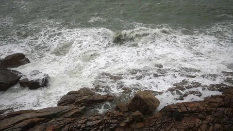 Large storm waves crashing on rocks in slow motion Stock Footage 111470605