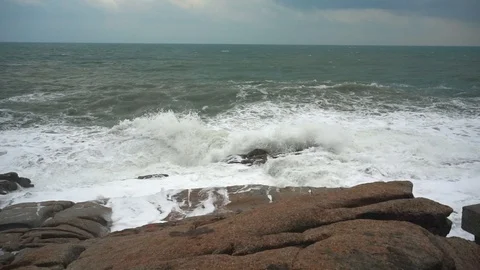 Large storm waves crashing on rocks in slow motion Stock Footage 111470644