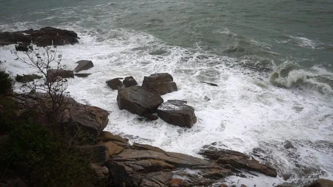 Large storm waves crashing on rocks in slow motion Stock Footage 111471015