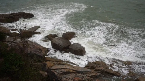 Large storm waves crashing on rocks in slow motion Stock Footage 111471181