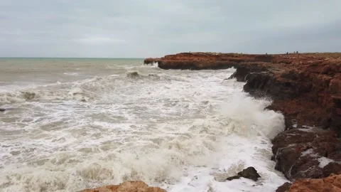 Large storm waves crashing on rocks in slow motion. Stock Footage 133798102