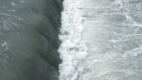 A large stream of water flows through the canal 4 動画素材 103972356