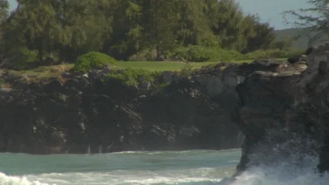 Large strong ocean waves crash onto cliff rocks Stock Footage 125340490
