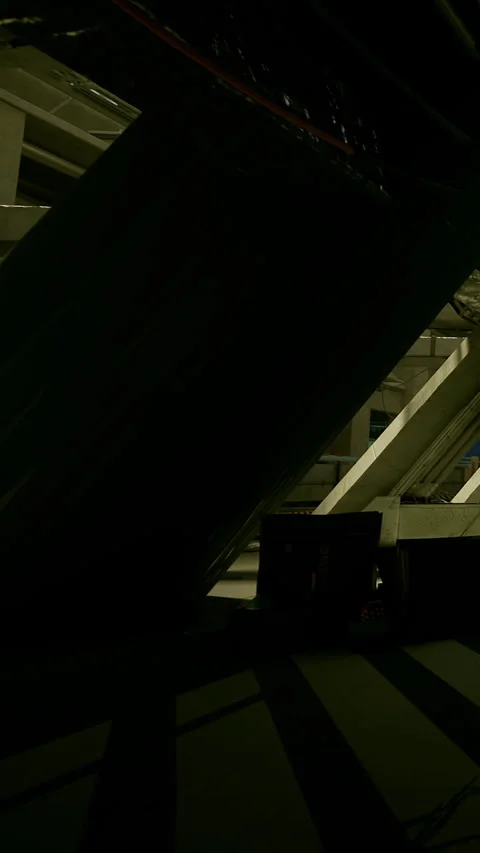 A large structure stands in the center of a dark space Video stock 339957596