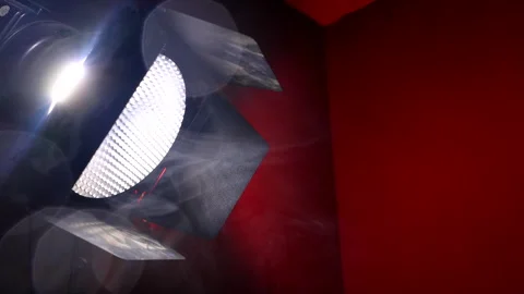 Large Studio Stage Light on Solid Red Background Stock Footage 295486573