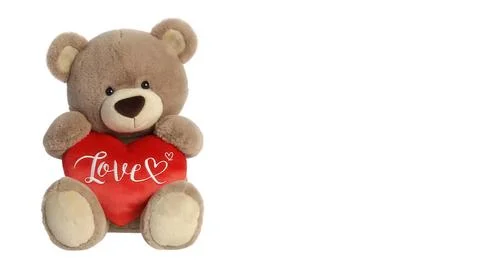Large stuffed bear with a red heart on white background for gifts Fotos de archivo