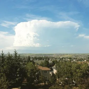 Large summer storm cloud over city Stock Photos