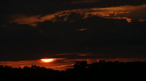 Large Sun setting behind dramatic clouds -3 Stock Footage 40505959