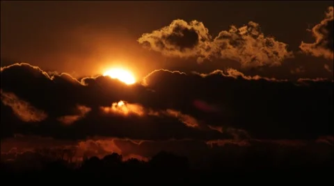 Large Sun setting behind dramatic clouds -2 Stock Footage 40507792