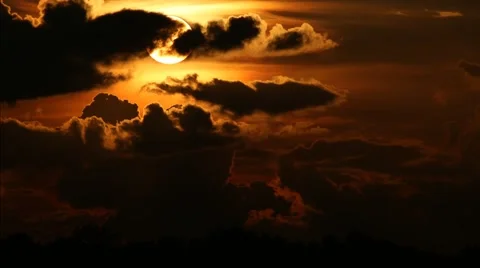 Large Sun setting behind dramatic clouds - 1 Stock Footage 40510359