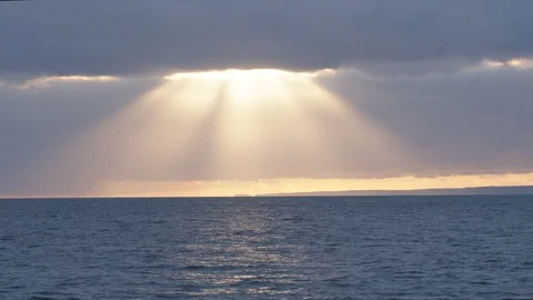 A large sunbeam over the ocean in Cornwall, England. Stock Footage 128172223