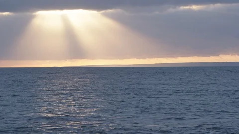 A large sunbeam over the ocean in Cornwall, England. Stock Footage 128213346