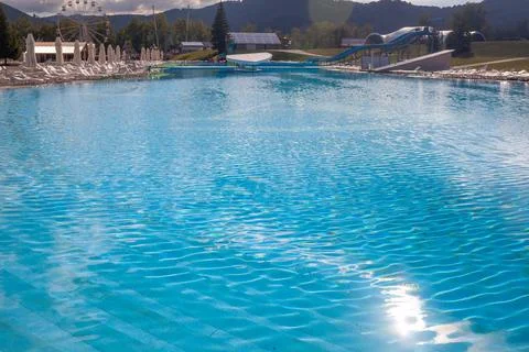 A large swimming pool with clear water in the open air against Stock Photos