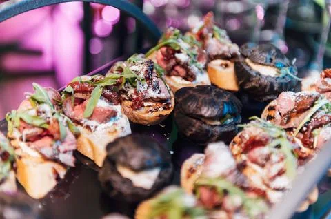 Large table with snacks of different types at a party with creative disco 스톡 사진