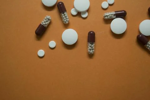 Large tablets, capsules are on the table Stock Photos