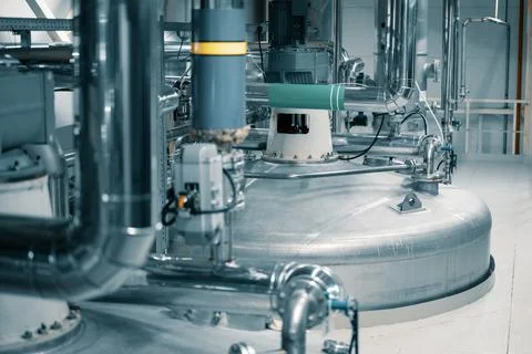 Large tank with processed aggressive liquids in workshop Stock Photos