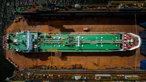 Large Tanker Ship Maintenance Inside Dry Dock At Industrial Shipyard High A.. Stock Photos