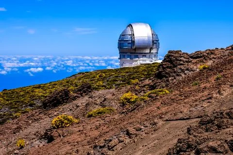 A large telescope is on a hillside Stock Photos