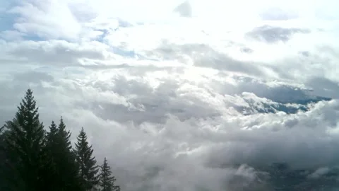 Large thick hanging white clouds over the forest Stock Footage 254151163