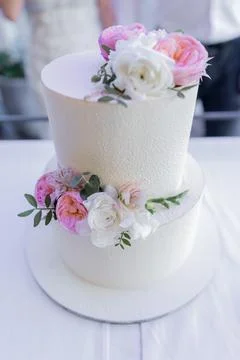 Large three-tiered cake at a wedding with decor delicious beautiful Stock Photos
