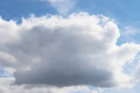 Large thunderclouds on the blue sky. Stock Photos