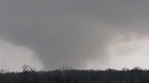 Large Tornado Grinds Across Field Stock Footage 112954039