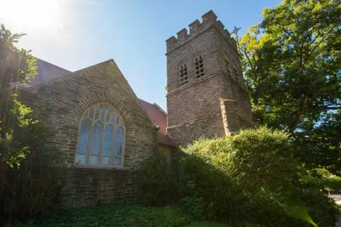 A Large Tower and Window on a Cobblestone Church Stock Photos