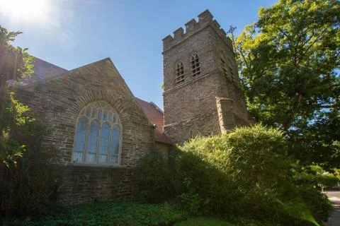 A Large Tower and Window on a Cobblestone Church Stock Photos