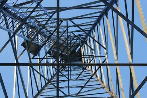 Large tower of metal structures against the blue sky. Metal construction. Stock-Fotos