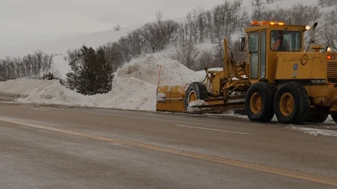 Large tractor removing snow from the highway. Stock Footage 102938301