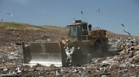 Large tractor working at a county landfill HD605 Stock Footage 10918908