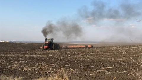 Large tractor working in the field, tractor plowing field Stock Footage 107548558
