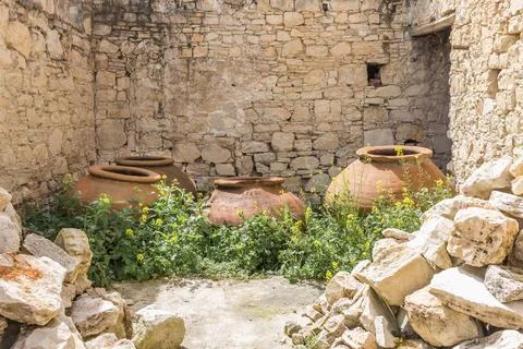 Large traditional clay jars placed on a street in Lofou village, Cyprus. Hist 写真素材