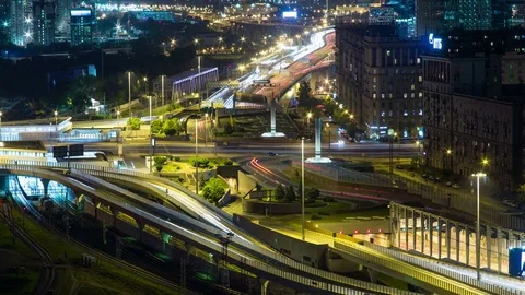 Large traffic junction. Traffic on the road at night. Timelapse 4K Stock Footage 77165615