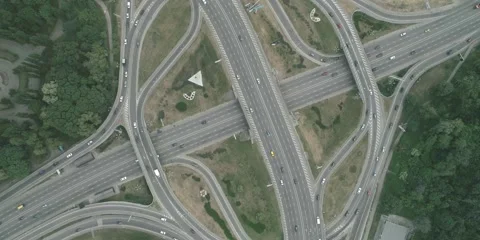 Large transport interchange on highway. Top view of traffic on roundabout Stock Footage 274568916